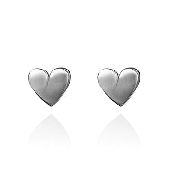 A pair of heart shaped stud earrings in silver.