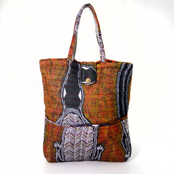 A quilted style tote baby bag printed with Indigenous artwork in brown, black and white.