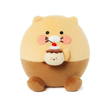 Plush toy resembling a bear with a cake on a white background.