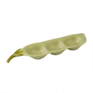 A green serving dish in the shape of a pea.
