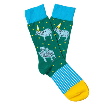 A pair of socks in green, blue and yellow and illustrated with sheep.