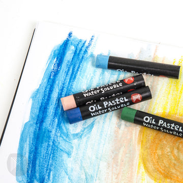 A pack of oil pastels shown both inside and outside the box in a tray.