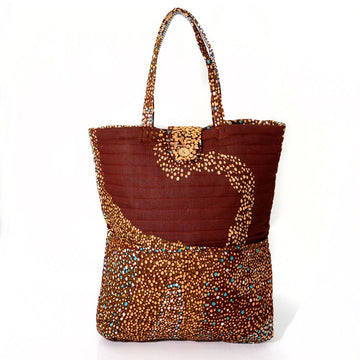 A quilted style tote baby bag printed with Indigenous artwork in shades of brown.