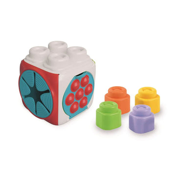 A baby toy shaped like a cube with different textured sides on a shallow box with product information.