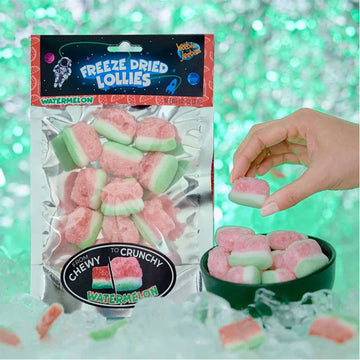 A packet of freeze dried watermelon lollies with lollies around the bag.