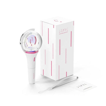 White light stick with pink accents next to a matching box on a white background.