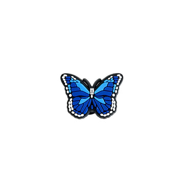 Blue butterfly-shaped PVC shoe charm on a white background.