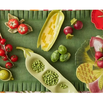 A green serving dish in the shape of a pea.