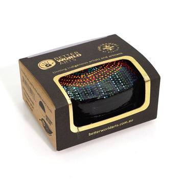 A trinket box inside a box with a cut out.