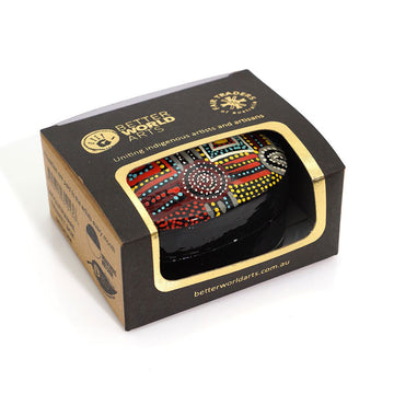 A trinket box inside a box with a cut out.