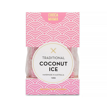 A pink and white patterned box with the heading 'Traditional Coconut Ice' in the middle and a window on the sides showing the coconut ice inside.