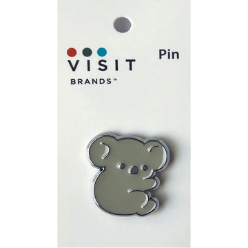 Koala shaped chrome pin attached to a white card.