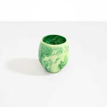 A cup made from green resin.