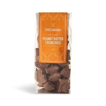A clear bag with a large orange label with the heading 'Peanut Butter Crunchies'. The chocolates can be seen inside the bag.