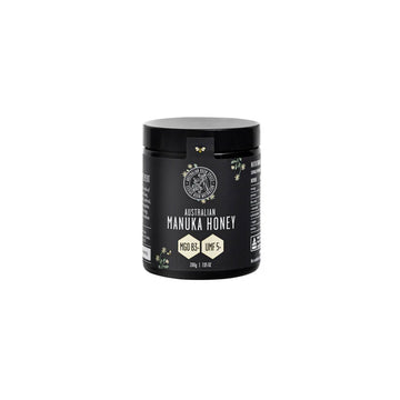 A black jar with a black label titled 'Australian Manuka Honey MGO83+ UMF5+'