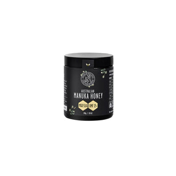 A black jar with a black label with the text 'Australian Manuka Honey MGO514+ UMF15+'.
