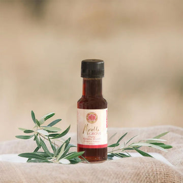 A small bottle of cherry balsamic vinegar.