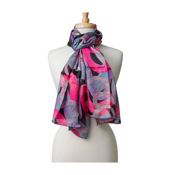 A silk scarf printed with artwork in pink and blue wrapped around the neck of a mannequin.
