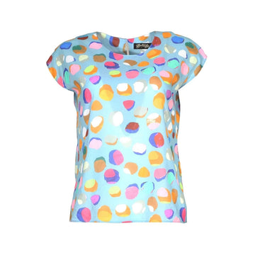 Colorful polka dot top with a light blue background.