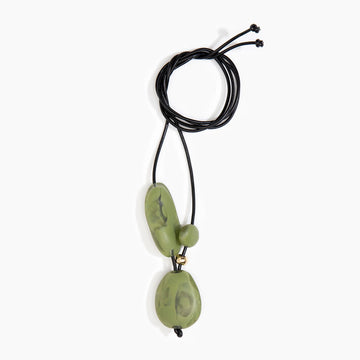 A necklace with large olive green resin beads on a black cord.