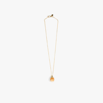 A gold necklace with an orange brown resin pendant.