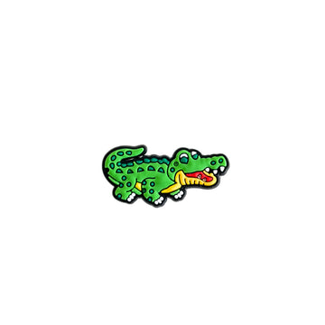 A crocodile shaped PVC shoe charm.
