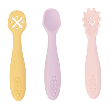 A silicone cutlery set with a piece in yellow, purple and pink.