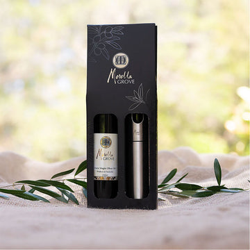 A gift pack with a bottle of olive oil and a stainless steel spray bottle inside.