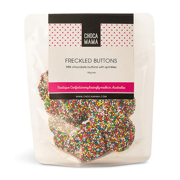 A clear bag filled with chocolate freckles with a product label and the text 'Freckled Buttons'.