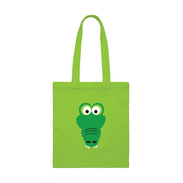 A green tote bag with an illustration of a crocodile's head in the middle.