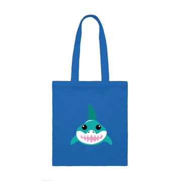 A blue tote bag with an illustration of a shark on the front.