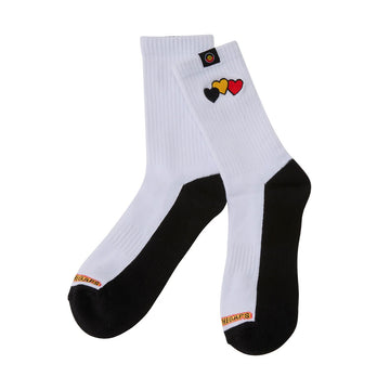 A pair of black and white socks with three embroidered hearts in black, yellow and red.