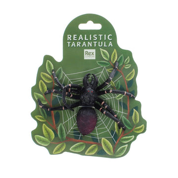 A tarantula toy attached to a green card with an illustration of a spiderweb and leaves with the heading 'Realistic Tarantula'.