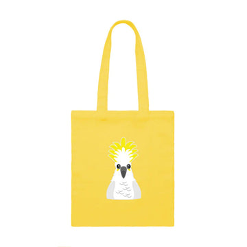 A yellow tote bag with an illustration of a cockatoo on the front.