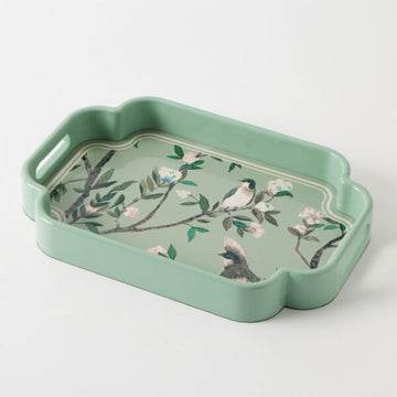 Green tray with bird and floral design on a white background.