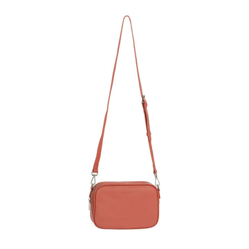 Front view of a box shaped cross body bag in terracotta.