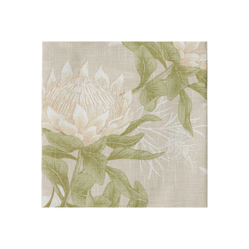 Floral patterned fabric swatch with protea flower and green leaves on a beige background.