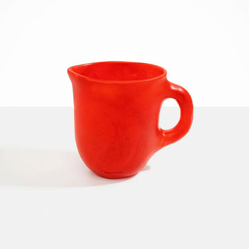 A large resin jug in red.
