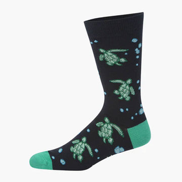 A navy sock with a green heel and toe and illustrated with turtles.