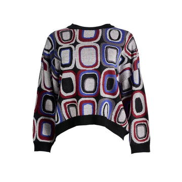 A knitted sweater with a coloured rounded square pattern in grey, red, blue and black.