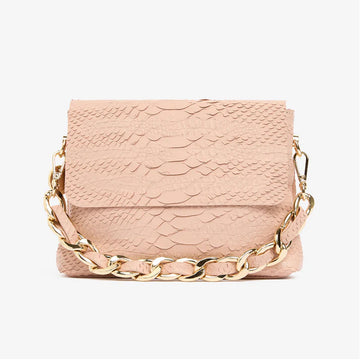 A small blush snake textured bag with a short gold chain strap.