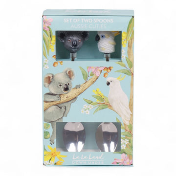 A pair of spoons with a koala head and a cockatoo head on the ends.