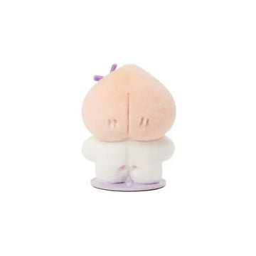 Plush toy with a round face, pink cheeks, and a small purple bow on a white background.
