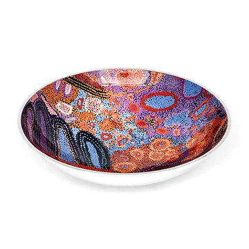 A round salad bowl in silver with artwork by Andrea Adamson on the inner side.