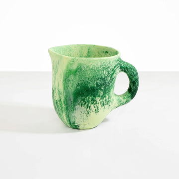 A large resin jug in green.