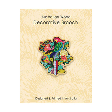 Colorful decorative brooch on a textured wooden background with text 'Australian Wood Decorative Brooch'.
