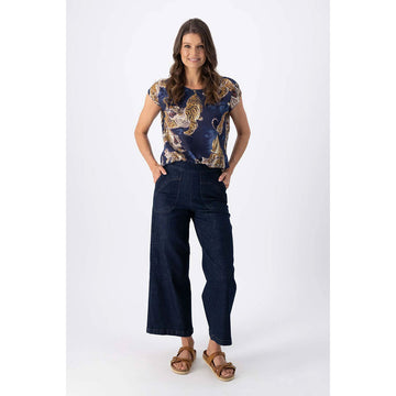 A pair of women's jeans in indigo blue with large side top stitched side pockets.