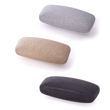 Three glasses cases, one in silver glitter, one in gold glitter, and one in black glitter.