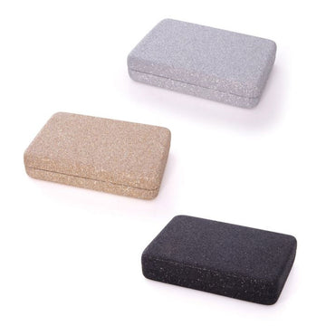 Three rectangle shaped cases in silver glitter, gold glitter and black glitter.