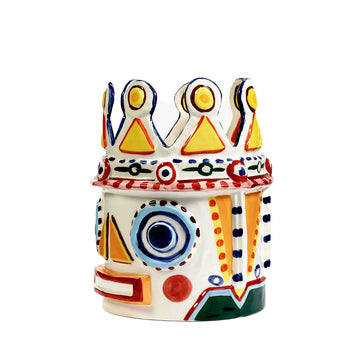 Colorful ceramic vase with abstract design on a white background